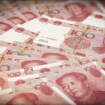 Chinese Yuan Gains as Central Bank Cools Markets Over Policy Easing